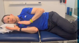 Physio demonstrating an exercise